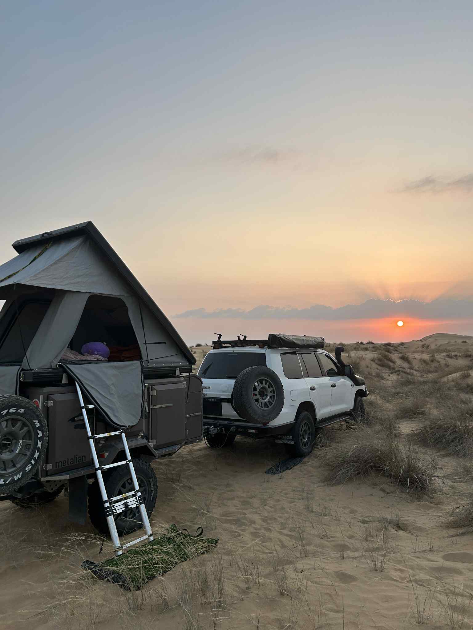 Desert camp at sunset